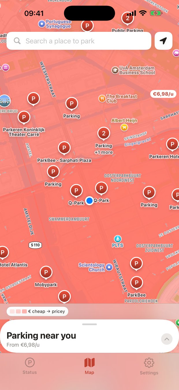 ParkWijs map of central Amsterdam with paid areas shaded by price and garages shown as pins.